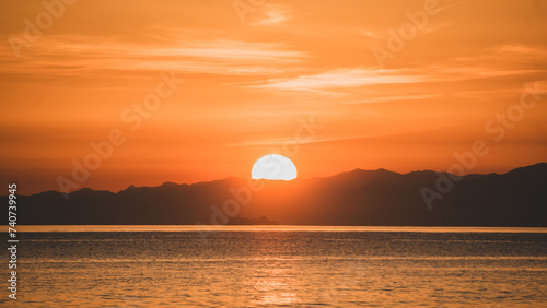 Sunset over the mountains in the beach