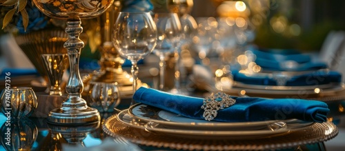 Elegant table setting with blue napkin and silverware, stylish dining concept