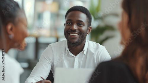 Engaged Professional Discussion At Modern Office Space, Attentive Individual Listening During Formal Meeting, Discussing Work Matters, Smiling Individual Wearing White Shirt At Job Interview, Laptop o