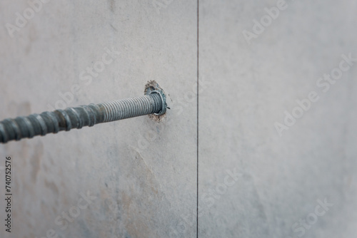 Drilling a hole into concrete wall, preparation for core drilling