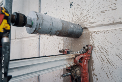 Drilling a hole into a concrete floor with core driller