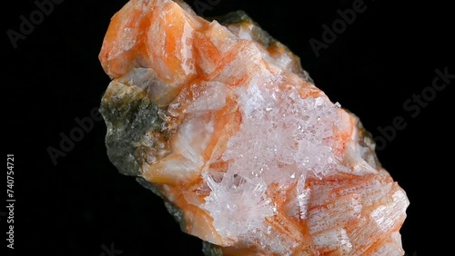 Clear Natrolite crystals on Orange Gmelinite (Glenarm, N. Ireland) photo
