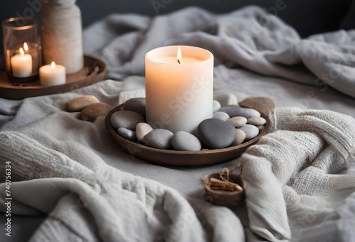 candle with stones in wooden plate
