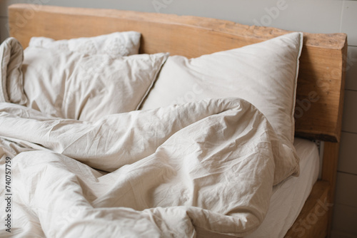 Fototapeta Naklejka Na Ścianę i Meble -  A bed with crumpled, stylish bed linen.
