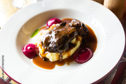 Beef cheek with mashed potatoes and currant oil