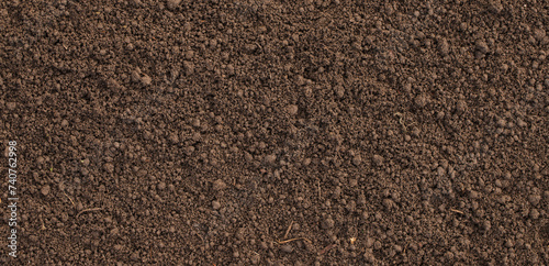 loosened soil as a background. brown ground surface