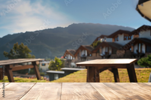 wooden table for display product, tables of wood for showing goods, empy surface, mountains landscape on the background