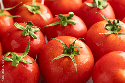 Fresh and ripe tomatoes on white background © banusevim