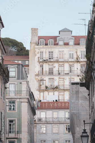 Ancient facade with the elevator sign to Saint George Castle at Lisbon, Portugal (Elevador do Castello in portuguese).