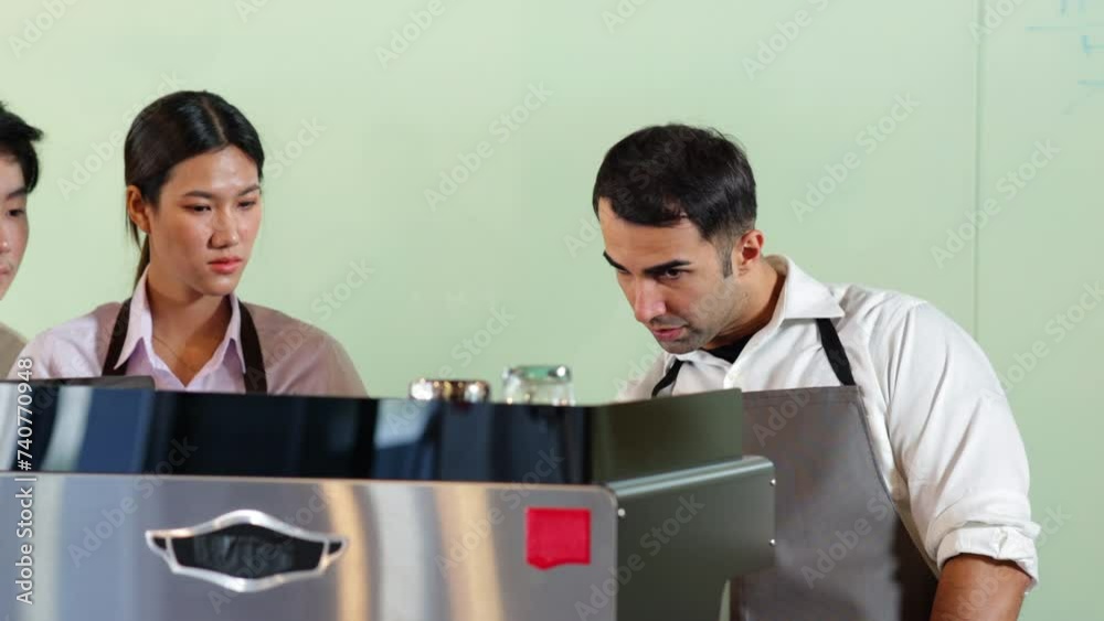 Coffee Machine Training Barista learning make coffee by espresso machine. Group schoolgirl ...