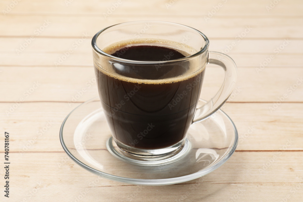 Cup of aromatic coffee on light wooden table, closeup Cup of aromatic coffee on light wooden table, closeup
