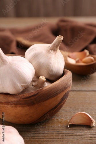 Fresh garlic on wooden table, closeup view