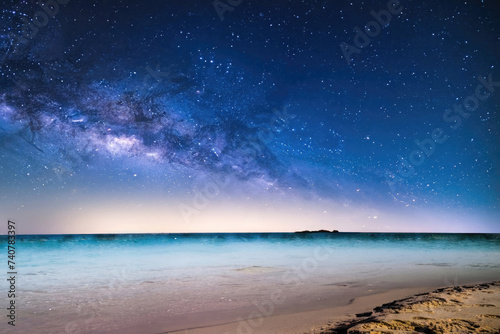 night landscape with stars, tropical beach at night, palm on the ocean, milky way in the sky