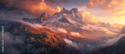 Majestic mountain shrouded in thick, swirling clouds at sunrise