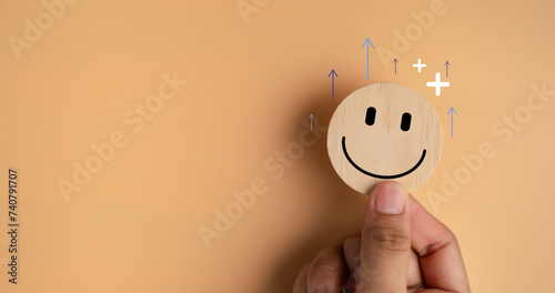 Happy smile relax face in wooden lable. Emotion happiness feed good positive thinking concept. Customer review assessment quality or feedback good mood, Happy mental. photo