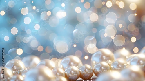 Beautiful group of shiny pearls on soft background with sparkles and light beams with copy space. White pearls whit gold in motion background. Pile of pearls on the shiny background