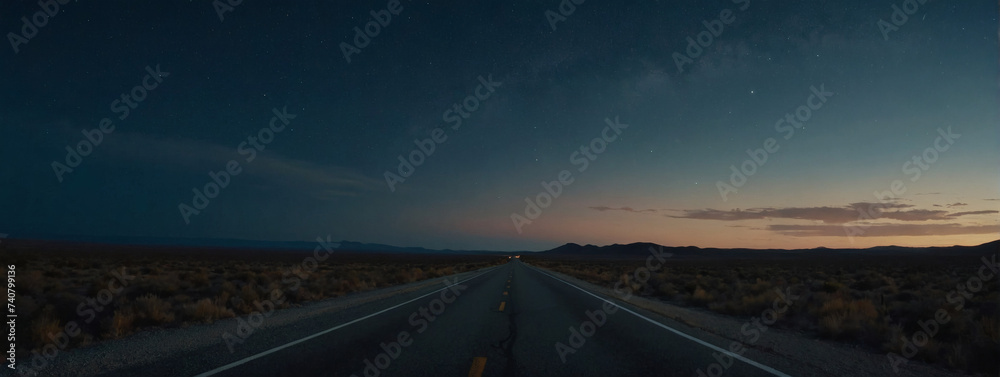Secluded highway with a deserted asphalt road, embraced by the vast night sky.