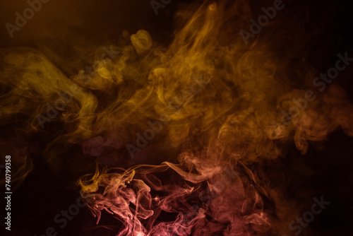 Yellow and pink steam on a black background.