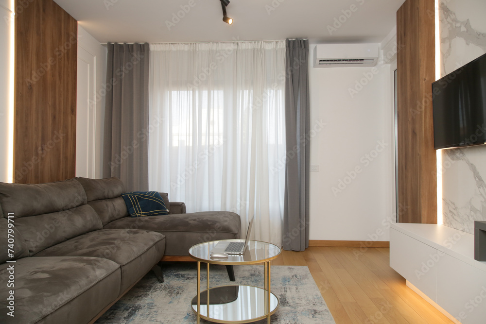 Fototapeta premium Modern,stylish and cozy living room with brown sofa and round coffee table
