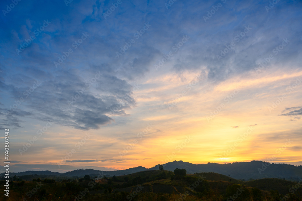Morning time of panorama mountain under dramatic twilight sky and cloud. Nightfall Silhouette mountain on sunset.
