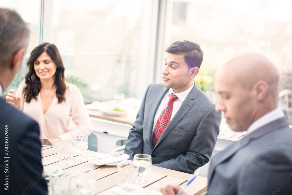 Businesswoman talking during restaurant meeting