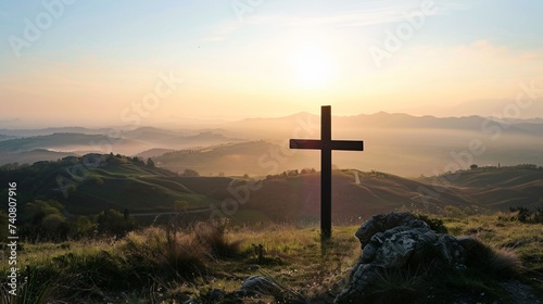 A backdrop of rolling hills behind the Cross of Jesus illustrating the journey of faith
