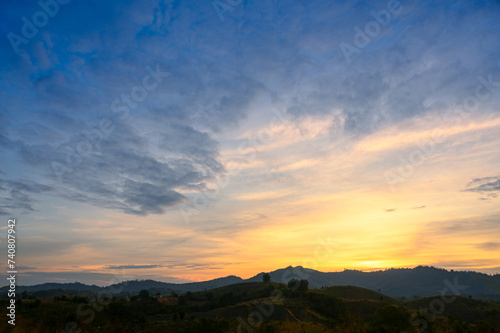Morning time of panorama mountain under dramatic twilight sky and cloud. Nightfall Silhouette mountain on sunset.