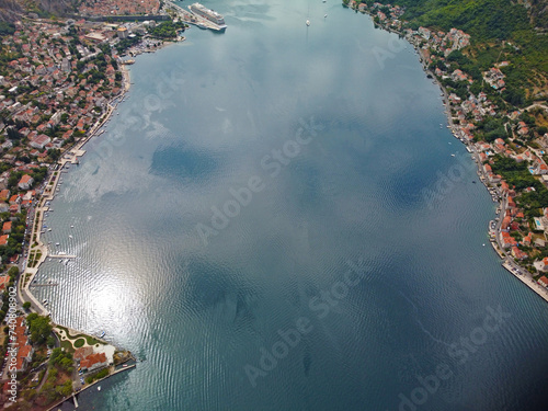 Aerial drone high view of Kotor bay, Boka Kotorska and coastal town Kotor, Cattaro, in Montenegro. Location place famous resort Montenegro. Adriatic fjord surrounded by rugged mountains