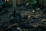 Metal Shovel in Earthy Soil at Twilight, Symbolizing Agricultural Work