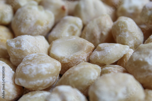 Background texture of dried Indonesian Candlenuts, or Kemiri, the seed of Aleurites moluccanus