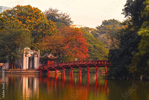 The Huc Bridge (Welcoming Morning Sunlight Bridge) over the Hoan Kiem Lake in Hanoi, Vietnam. photo