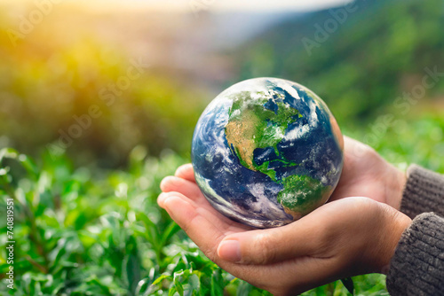 crystal earth in hands. green planet on hand. save of earth. environment concept for background web or world guardian organization.