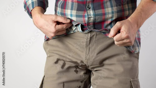 Man Pee His Pants, close-up.  A man suffering from pain in the pelvic organs photo