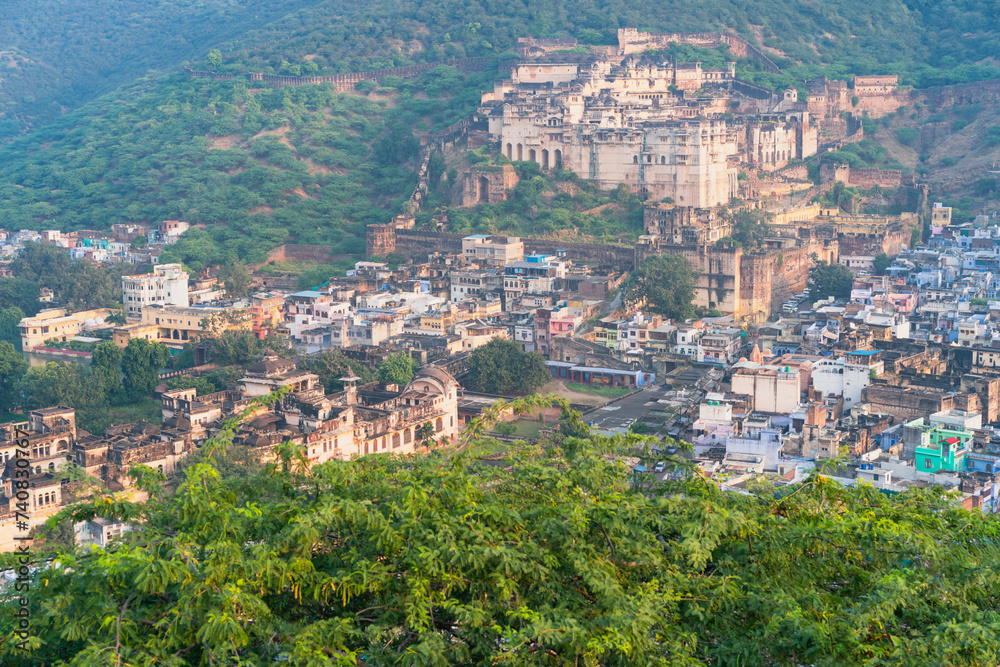 Elevated view of Bundi surrounded by Aravalli hills and trees. Rajasthan, India.