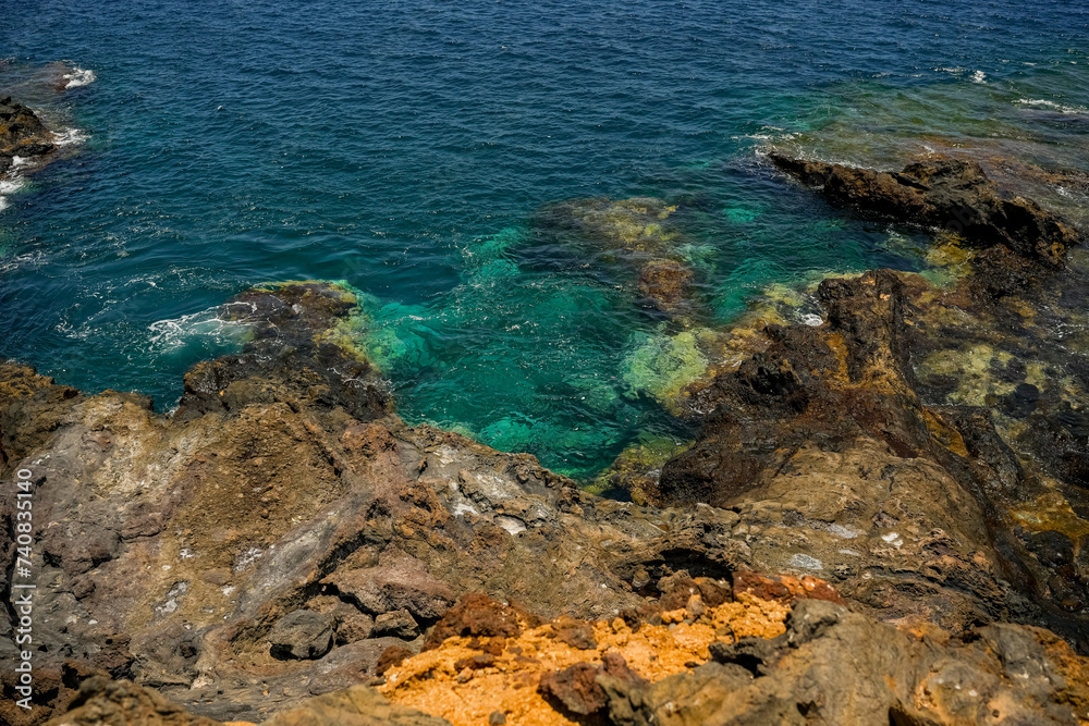 Beautiful rocks and turquoise sea on the coast of the Canary Islands, Tenerife Spain.	