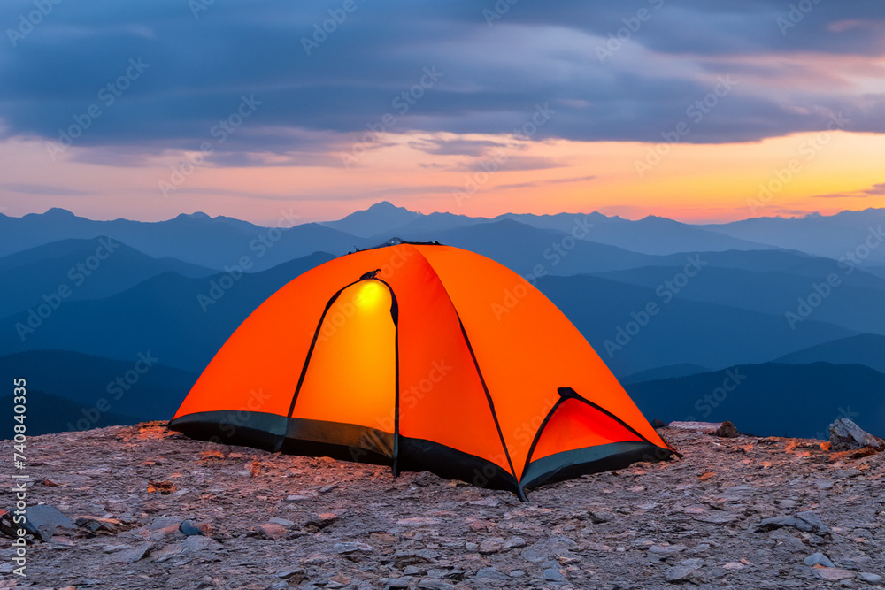 Glowing orange tent in the mountains under dramatic evening sky, mountains in the background. created generative ai