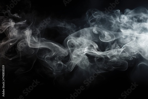 Abstract smoke on solid black background. Swirling air humidifier mist for creative projects
