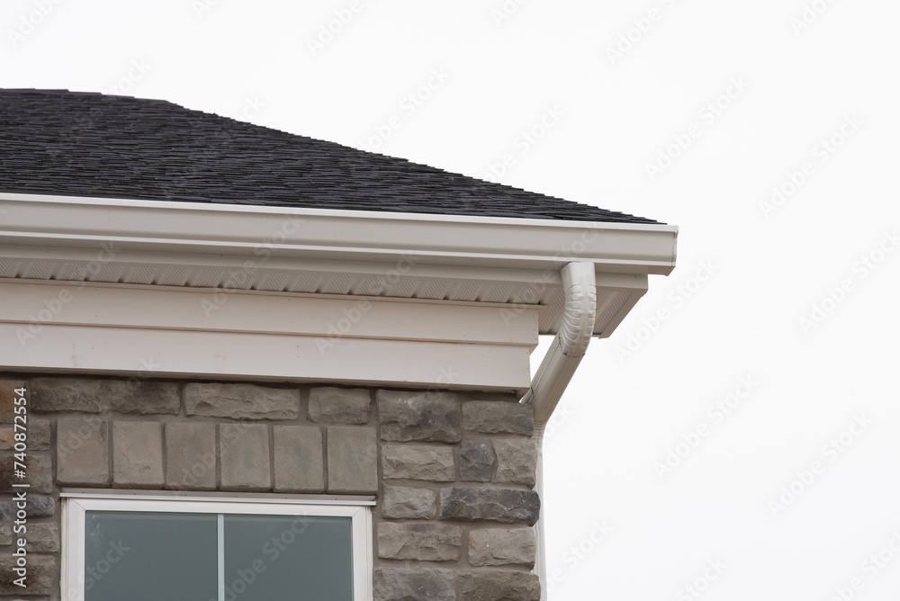 roof gutters on a residential house roof gutters on a residential house