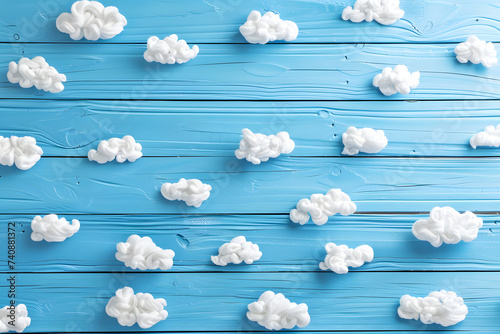 Cute children or baby background with white clouds on the blue wooden.
