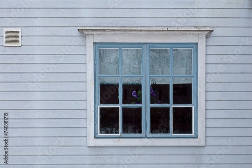 Old weathered window on a wood building.