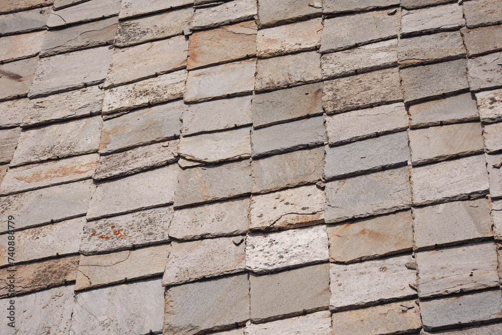 Aged slate roof tiles close-up. Abstract Detail of Old Slate Roof Tiles. slate shingles,beautiful detailed slate roof.The slates made by hand Aged slate roof tiles close-up. Abstract Detail of Old Slate Roof Tiles. slate shingles,beautiful detailed slate roof.The slates made by hand