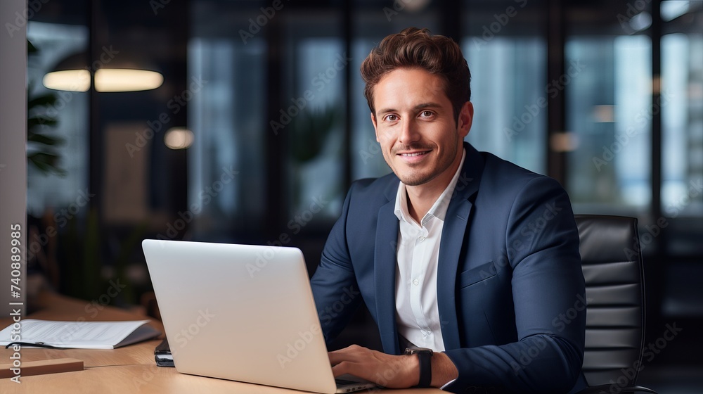 Portrait of young businessman working in office Portrait of young businessman working in office