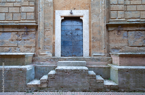 wooden door at the entrance of Palazzo Piccolomini in Pienza photo