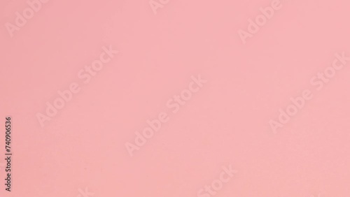 Cosmetic bubble rolls on a pink background  photo