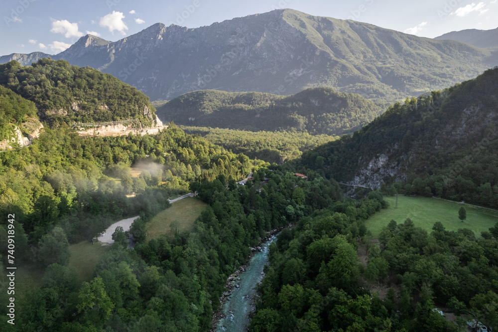 Foggy sunrise over Soca river near Kobarid in Slovenia, aerial drone view