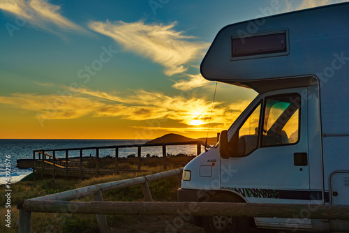 Caravan on coast at sunset © Voyagerix
