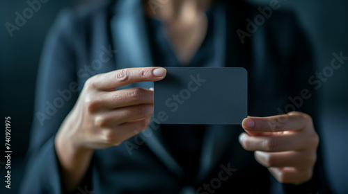 professional person holding a black card