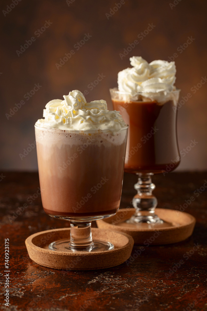 Creamy milk chocolate drinks with whipped cream. Creamy milk chocolate drinks with whipped cream.