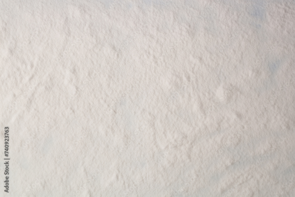 Flour texture. White flour on dark table. Baking background. Top view, copy space
