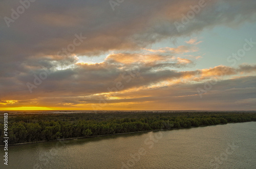 Idyllic scenic nature landscape scenery in Mississippi River delta with marsh, fisher boats, wildlife birds and animals, oil towers and horizon views photo